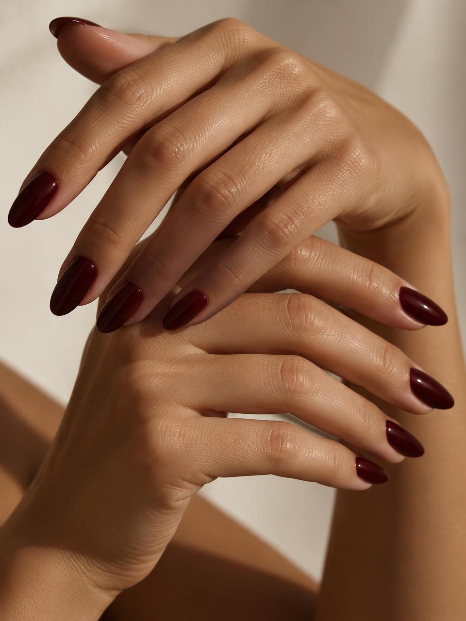 Oxblood manicure on sculpturally posed hands